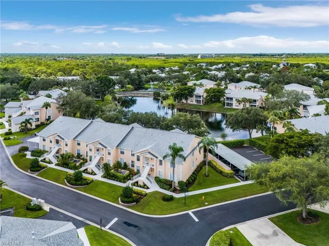Aerial perspective of suburban area with a nearby body of water