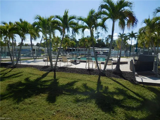 View of property's community pool and deck