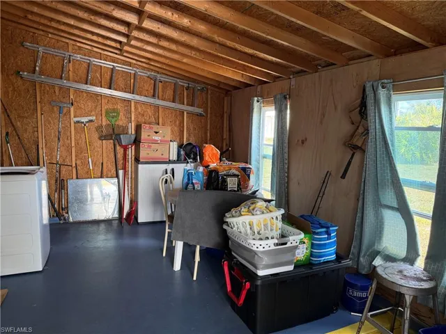 Misc room with finished concrete floors