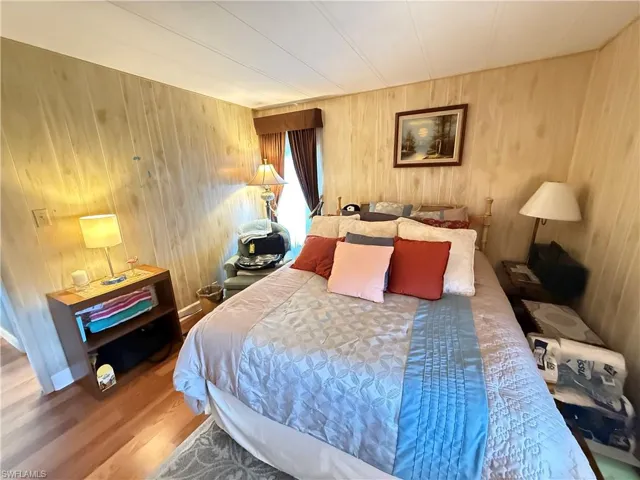 Bedroom with wood finished floors