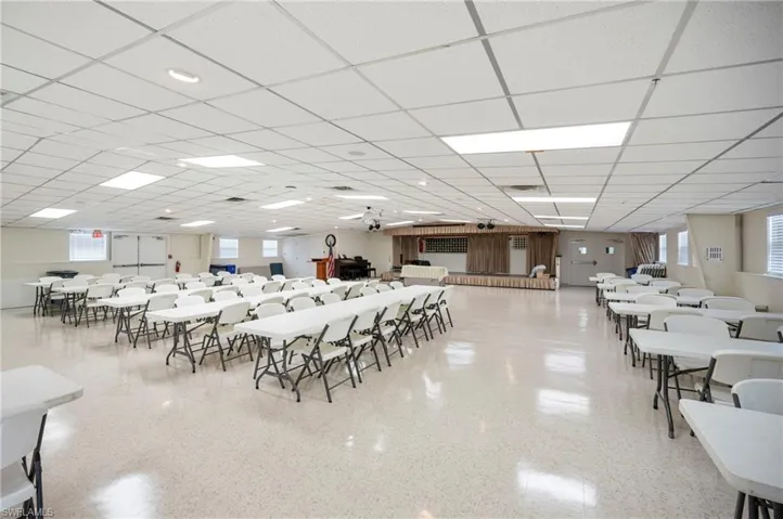 Dining room with healthy amount of natural light and a drop ceiling