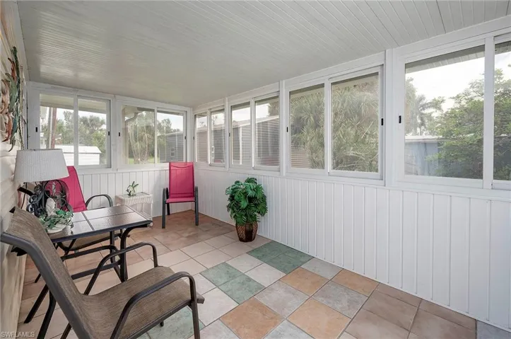 Sunroom / solarium featuring a healthy amount of sunlight
