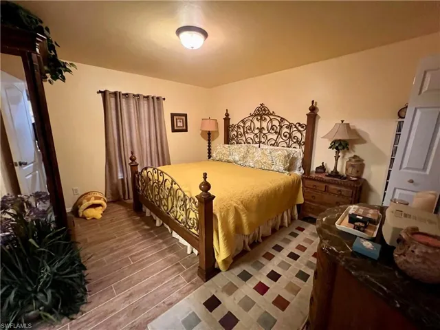 Bedroom with light hardwood / wood-style floors