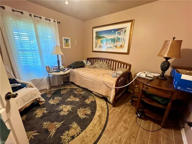 Bedroom with wood-type flooring