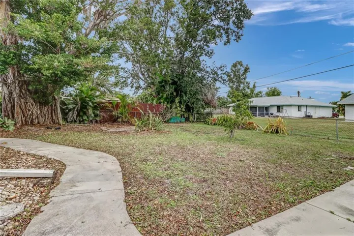 Backyard, decorative sidewalk around the home