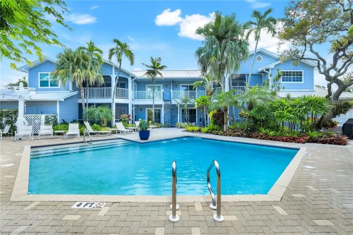 Swimming pool with a patio area and a balcony