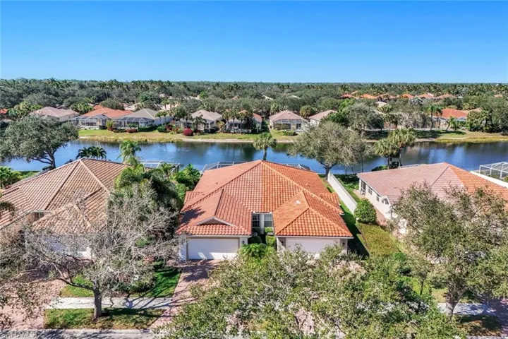 Aerial view of residential area with a large body of water