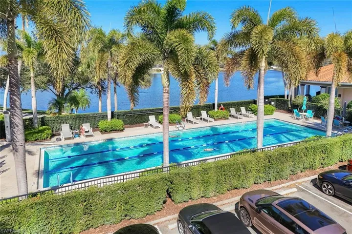 Community pool with a patio