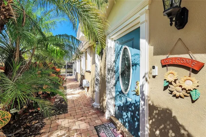 Doorway to property with stucco siding