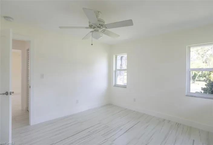 Empty room featuring ceiling fan