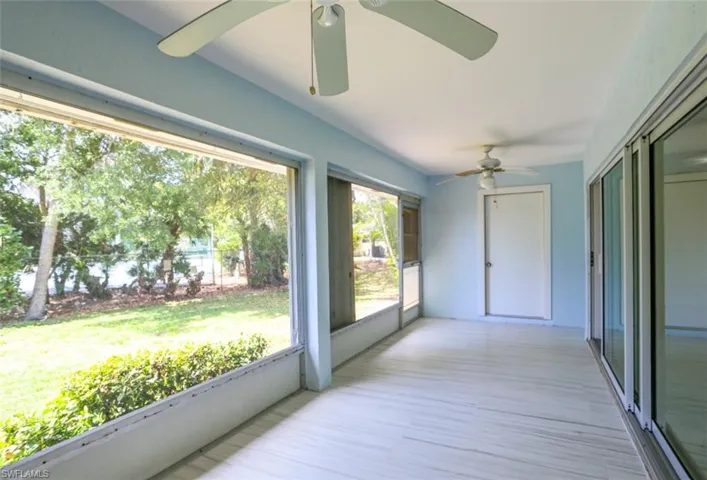 Sunroom / solarium featuring ceiling fan