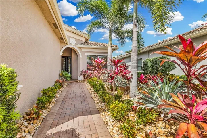 Stunning entry with upgraded landscaping.