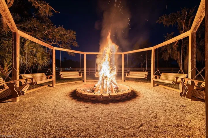 View of yard featuring an outdoor fire pit