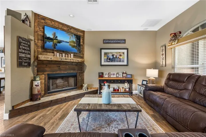 Living room featuring hardwood / wood-style floors and a fireplace