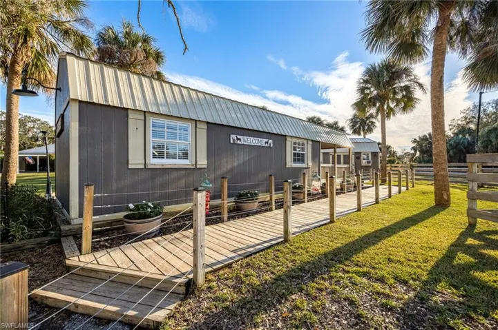 Back of house featuring a yard
