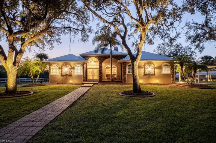 Ranch-style house featuring a yard