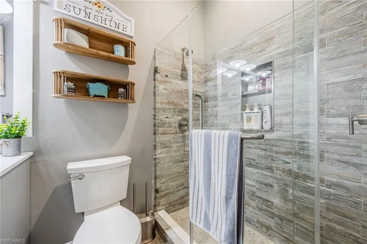 Bathroom with an enclosed shower and toilet