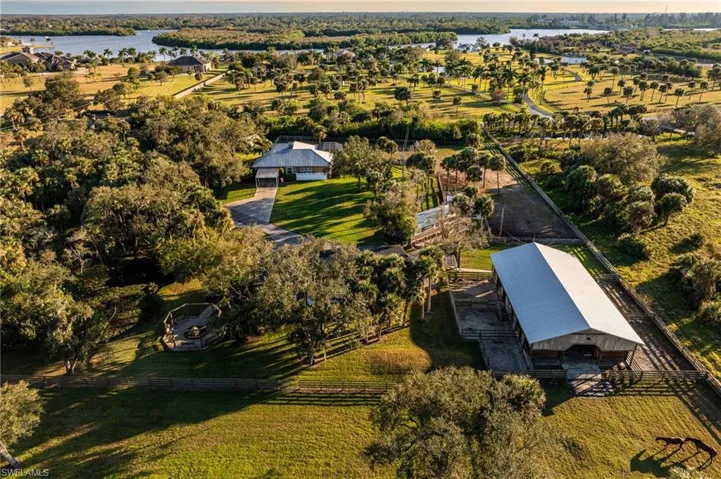 Birds eye view of property featuring a rural view and a water view