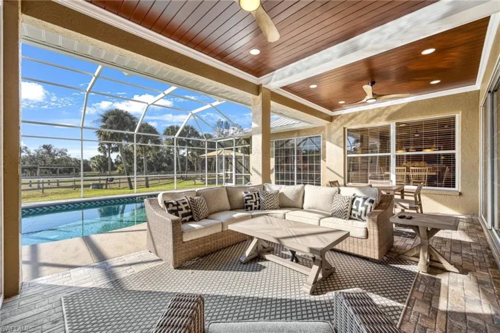 View of patio / terrace featuring a lanai, an outdoor hangout area, and ceiling fan