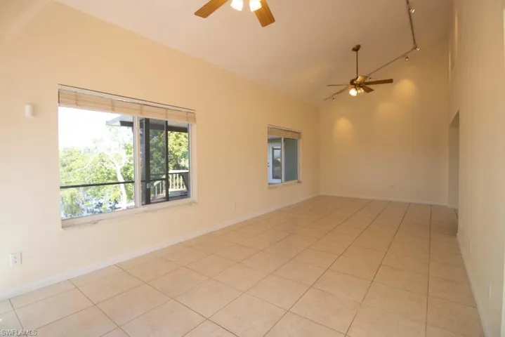 Empty room featuring light tile patterned flooring, french doors, and recessed lighting
