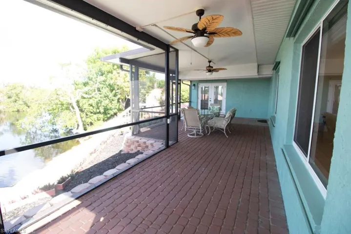 Sunroom featuring ceiling fan