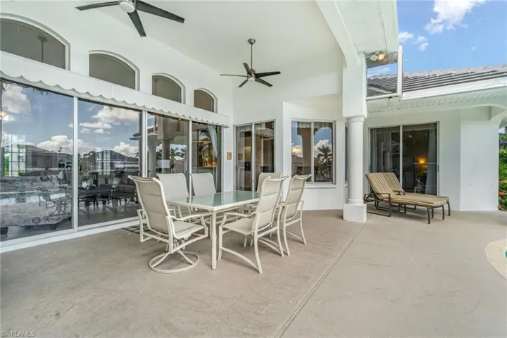 View of patio / terrace with a ceiling fan and outdoor dining space