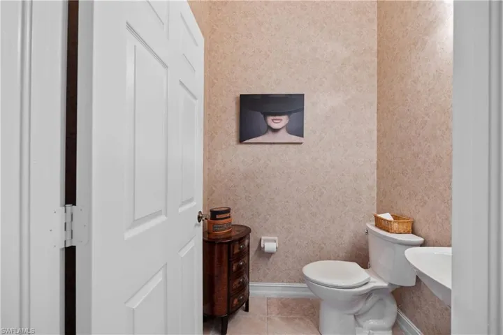 Bathroom featuring tile patterned floors and toilet