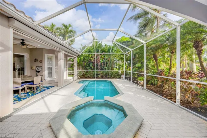 View of swimming pool with a patio area, ceiling fan, outdoor lounge area, and an in ground hot tub