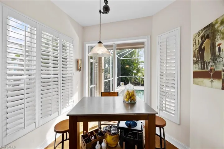 Dining area with hardwood / wood-style floors