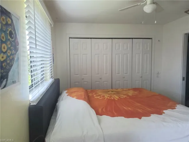 Bedroom with a closet and ceiling fan