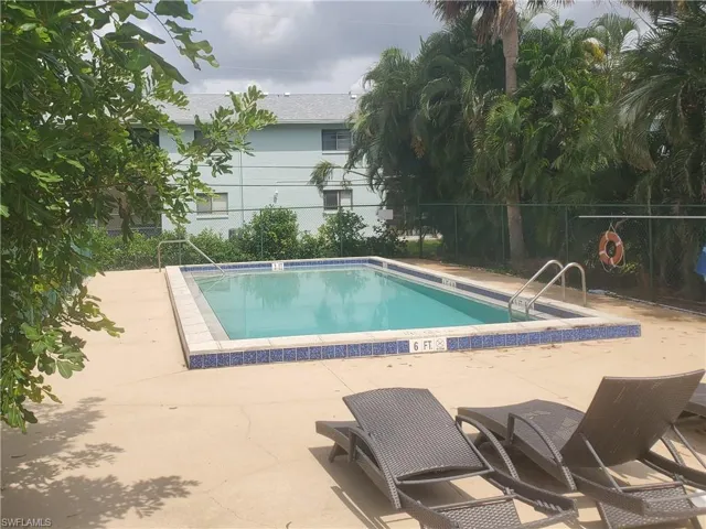 View of swimming pool with a patio area