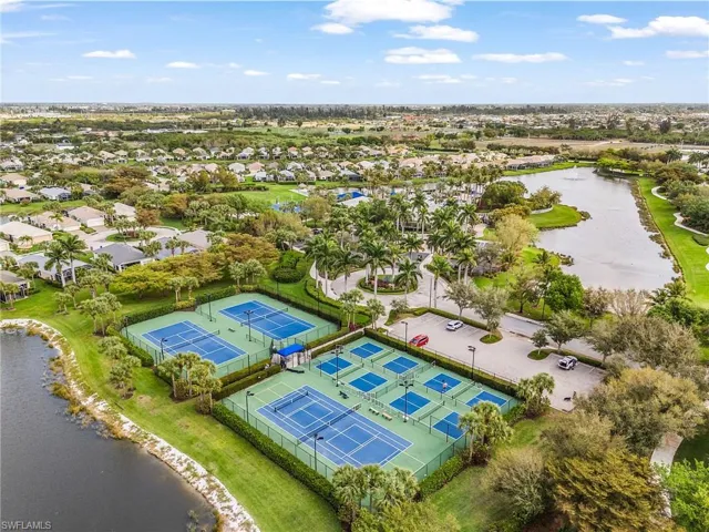 Aerial perspective of suburban area featuring a large body of water