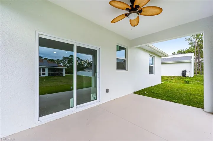 View of patio featuring ceiling fan