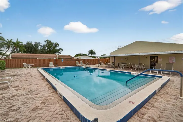 Community pool featuring a patio