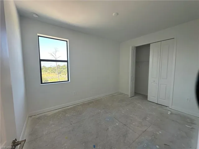 Unfurnished bedroom with a closet