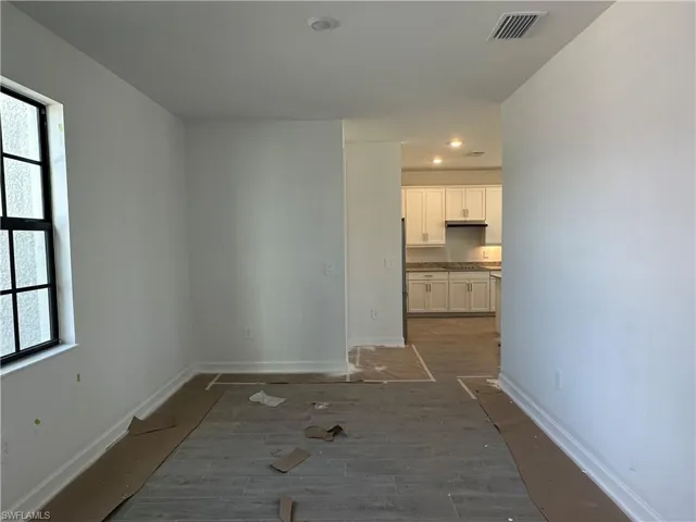 Hallway featuring dark hardwood / wood-style flooring