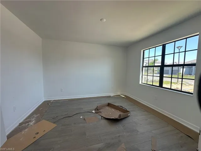 Spare room with hardwood / wood-style flooring