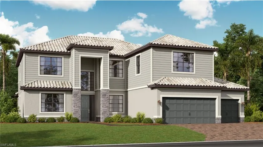 Mediterranean / spanish-style house with a front yard and a garage