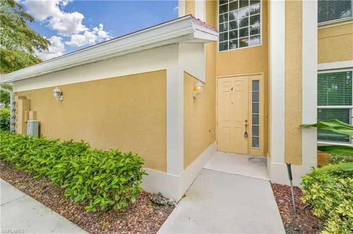 Entrance to property featuring stucco siding