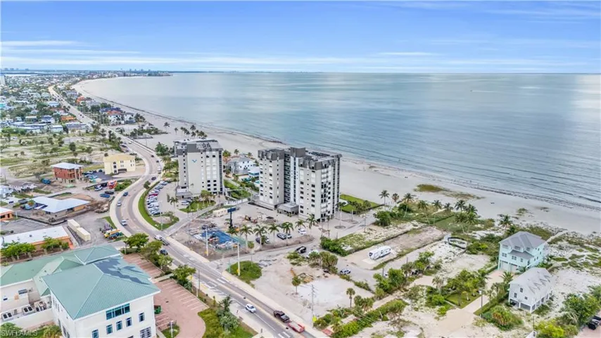 Drone / aerial view with a water view and a view of the beach