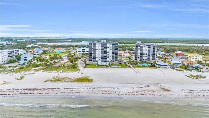 Drone / aerial view with a beach view and a water view
