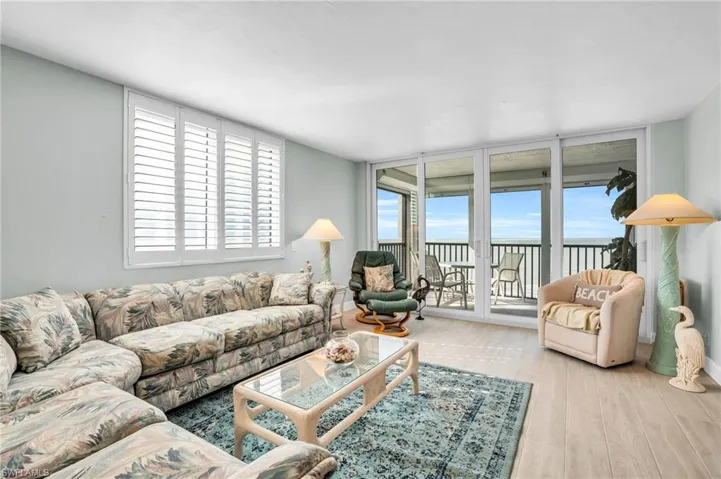 windows, a healthy amount of sunlight, and light hardwood / wood-style floors