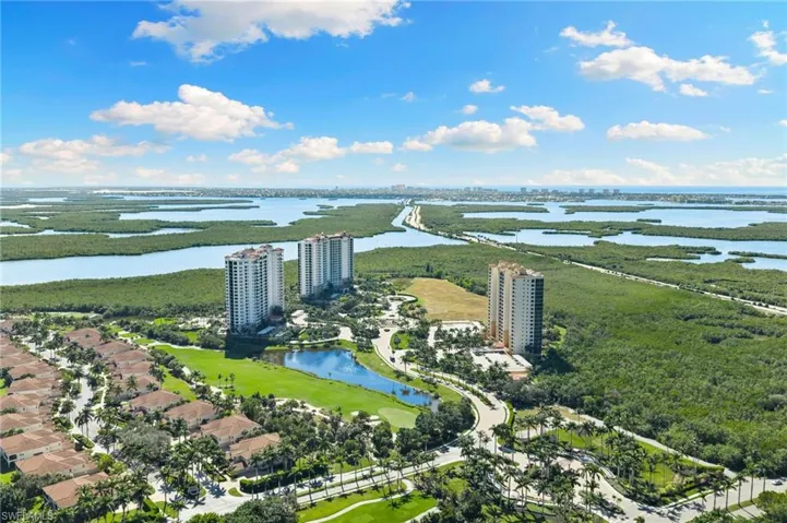 Bird's eye view of a large body of water and apartment complex