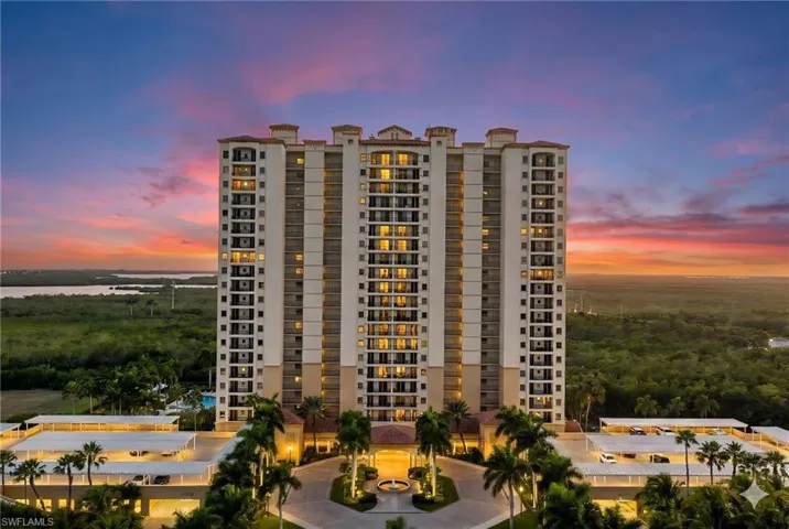 View of apartment building / complex with a water view