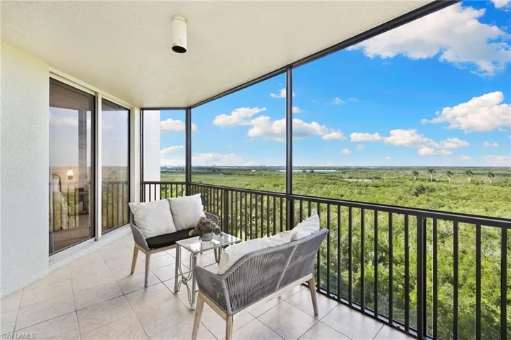 Sunroom / solarium featuring a balcony and outdoor lounge area