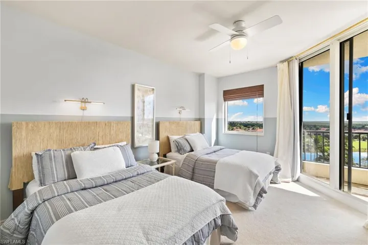 Bedroom with access to exterior, carpet floors, and ceiling fan