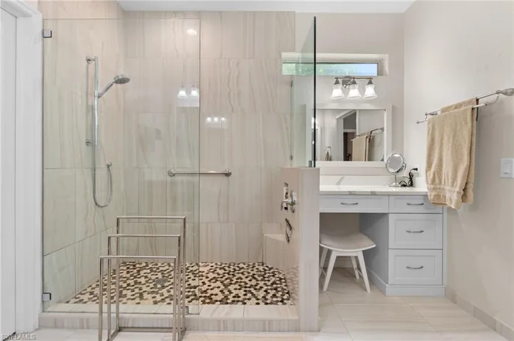 Primary bathroom with updated shower, walk in closet.