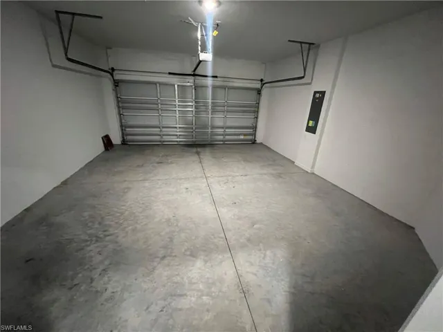 Garage featuring a garage door opener