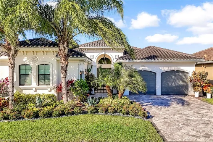 Mediterranean / spanish-style house with stucco siding and a tile roof