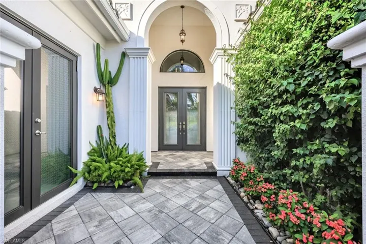 Entrance to property with french doors and stucco siding